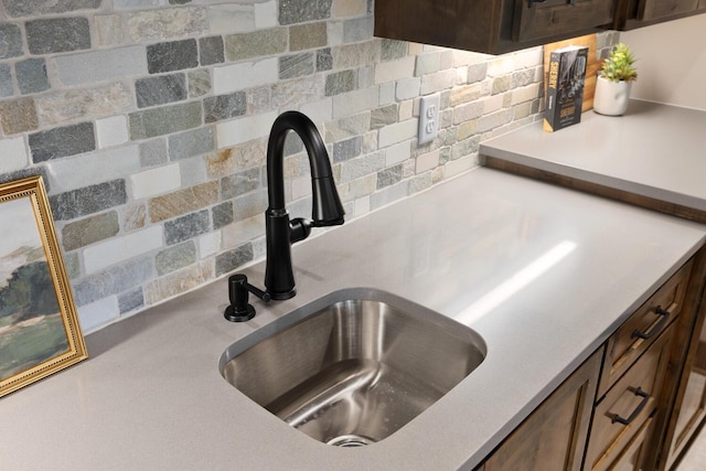 interior details with sink and dark brown cabinets