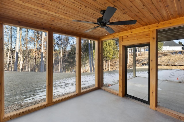 unfurnished sunroom with wooden ceiling and ceiling fan