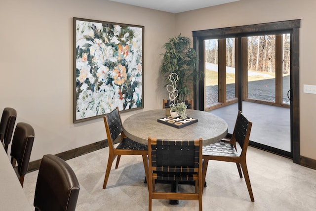 dining space featuring light tile patterned floors