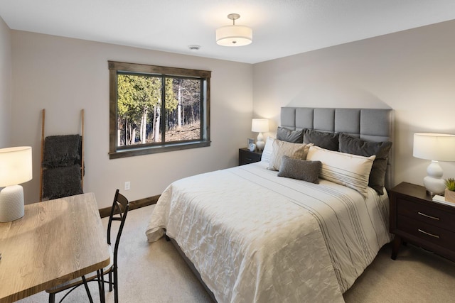 bedroom featuring light carpet