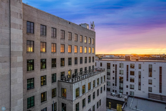 view of outdoor building at dusk