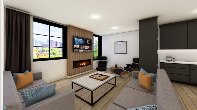 living room featuring light wood-type flooring and a fireplace