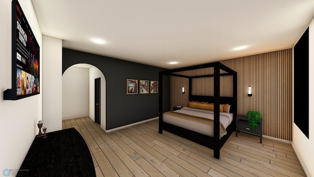 118 Broadway N Unit 802, Fargo, ND 58102 - bedroom with arched walkways, light wood-style floors, and recessed lighting