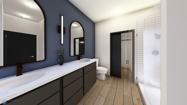 bathroom featuring hardwood / wood-style flooring, vanity, toilet, and walk in shower