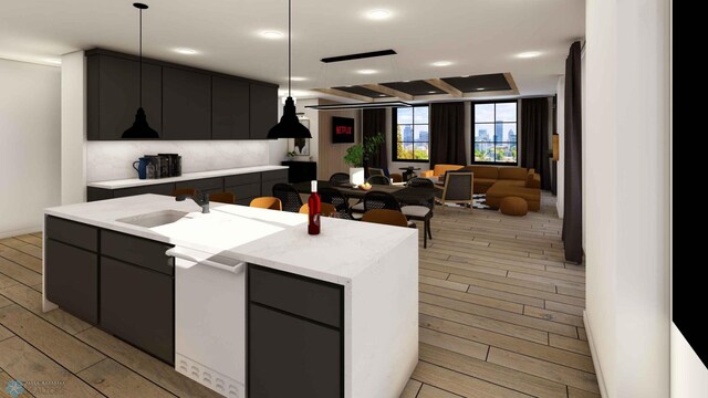 118 Broadway N Unit 803, Fargo, ND 58102 - kitchen featuring open floor plan, decorative light fixtures, a kitchen island with sink, light stone counters, and recessed lighting