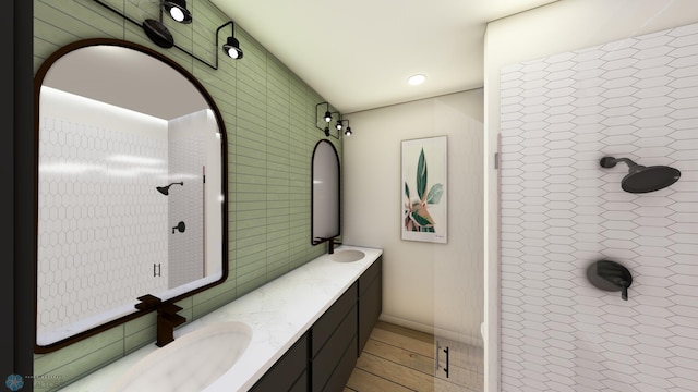 118 Broadway N Unit 703, Fargo, ND 58102 - full bath with double vanity, tiled shower, and tile walls