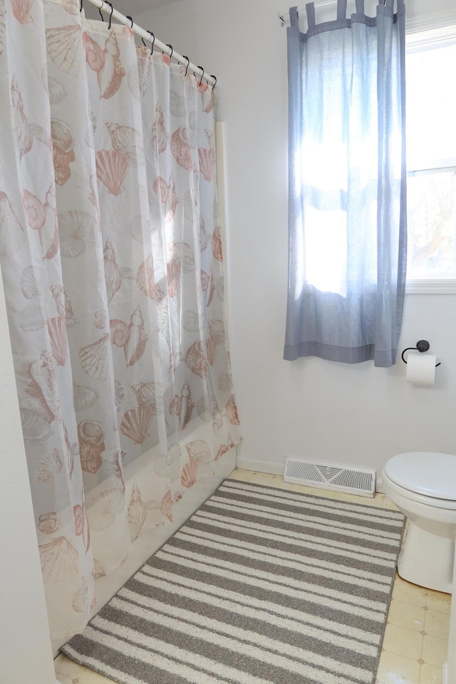 full bathroom with visible vents, tile patterned flooring, and toilet