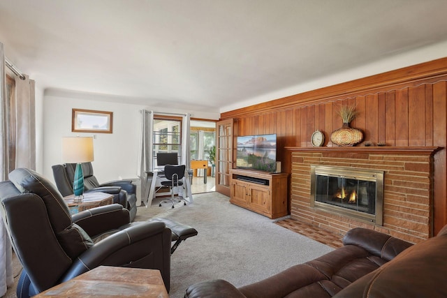 3522 Benjamin St NE, Minneapolis, MN 55418 - carpeted living room featuring a brick fireplace, wooden walls, and an office area