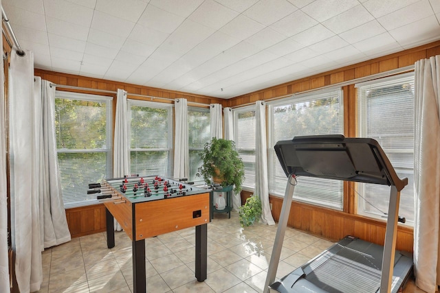 3522 Benjamin St NE, Minneapolis, MN 55418 - playroom featuring wood walls and light tile patterned flooring