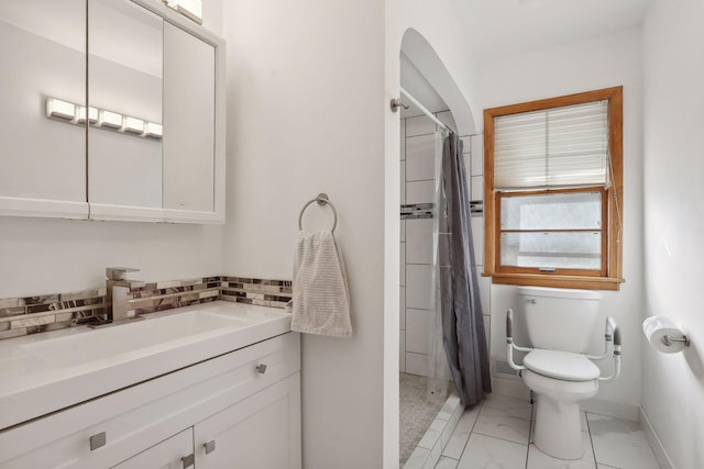 3522 Benjamin St NE, Minneapolis, MN 55418 - full bathroom featuring marble finish flooring, toilet, baseboards, a shower with curtain, and vanity