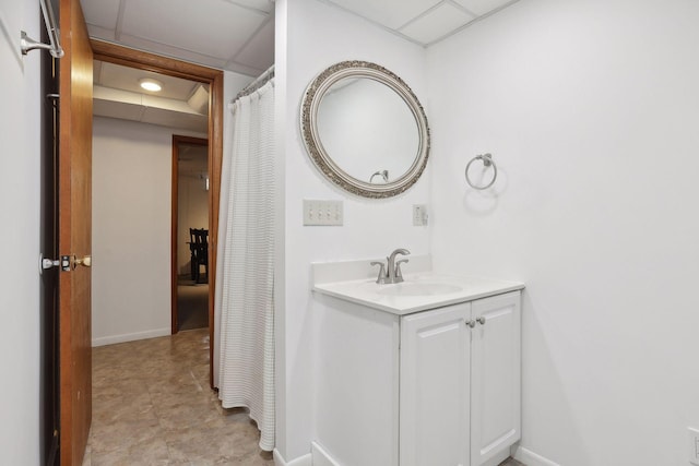 3522 Benjamin St NE, Minneapolis, MN 55418 - bathroom with vanity, baseboards, and a drop ceiling