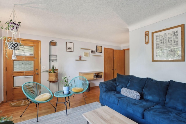 3522 Benjamin St NE, Minneapolis, MN 55418 - living area featuring a textured ceiling and wood finished floors