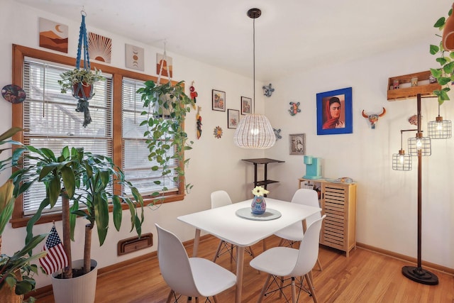 3522 Benjamin St NE, Minneapolis, MN 55418 - dining area with light wood-style flooring and baseboards