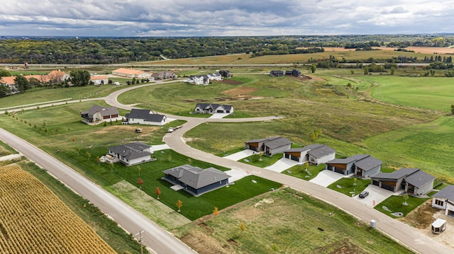 birds eye view of property with a rural view