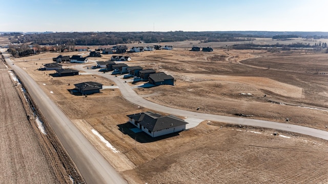 birds eye view of property with a rural view