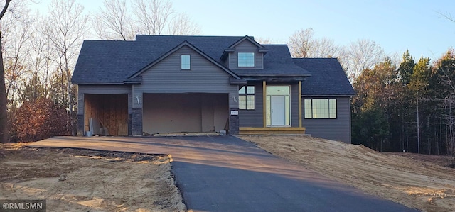 view of front of property featuring a garage