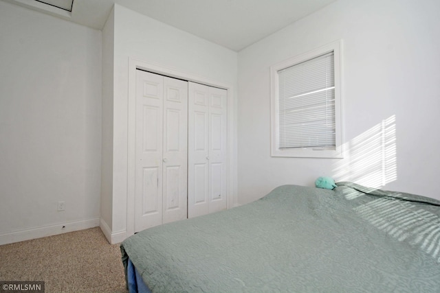 bedroom with carpet floors and a closet