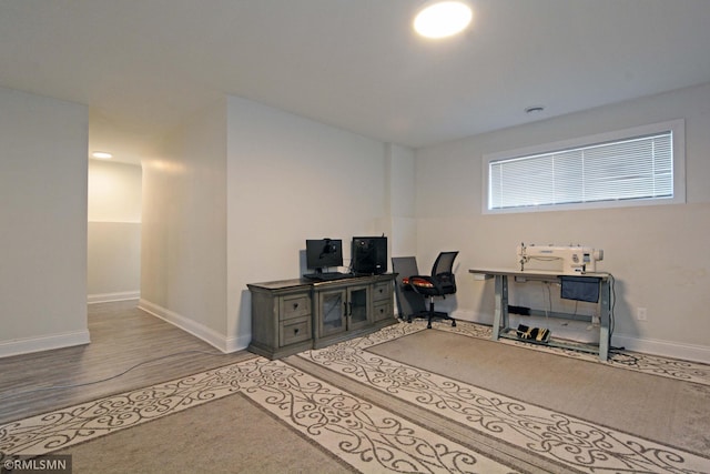 office with light wood-type flooring