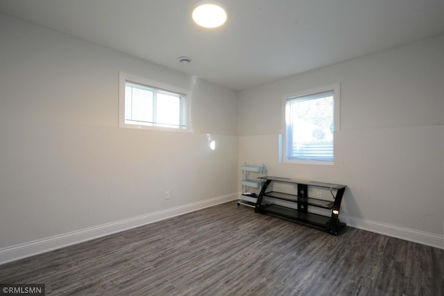 spare room featuring dark hardwood / wood-style flooring