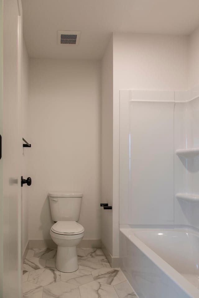 bathroom with a bathtub and toilet