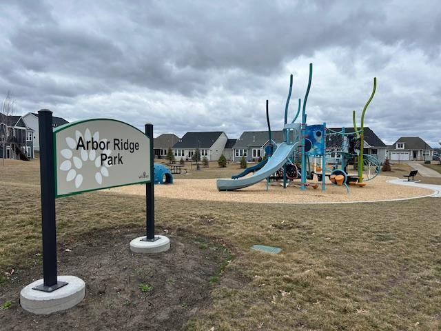 view of jungle gym featuring a lawn