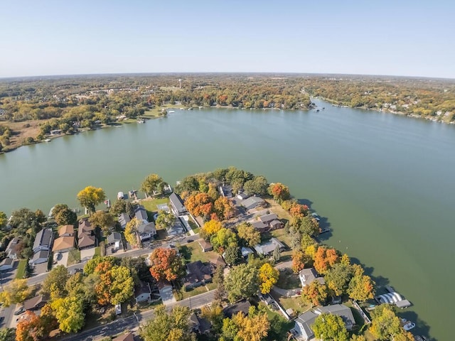drone / aerial view with a residential view and a water view