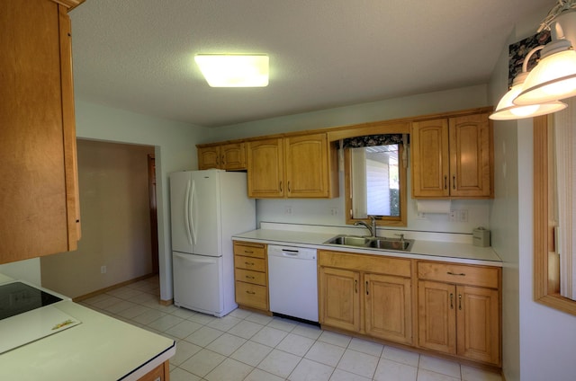 kitchen with a textured ceiling, white appliances, light tile patterned floors, and sink