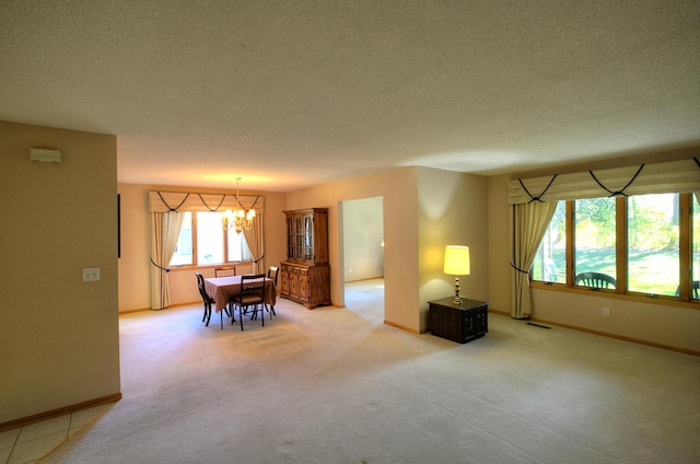 interior space with a chandelier and a textured ceiling