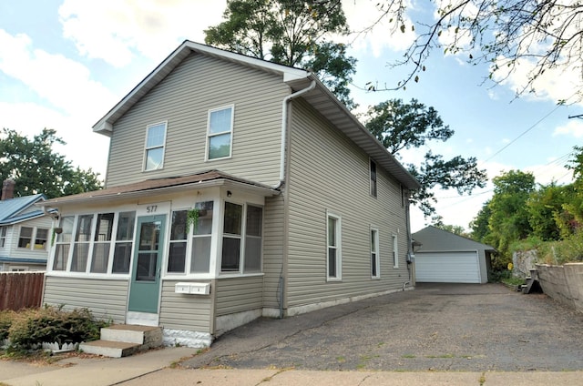 view of front of house with an outbuilding and a garage