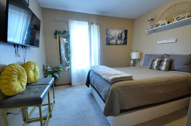 bedroom featuring light carpet