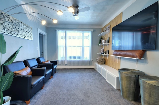 carpeted living room with ceiling fan