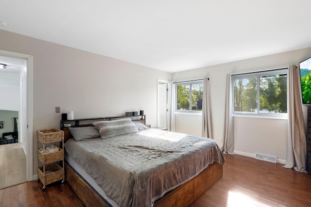 bedroom with hardwood / wood-style floors