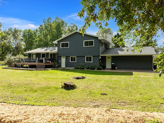 back of house with a lawn and a wooden deck