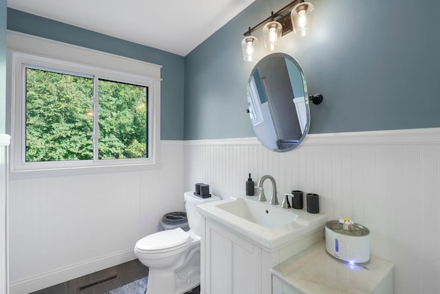 bathroom featuring hardwood / wood-style floors, vanity, and toilet