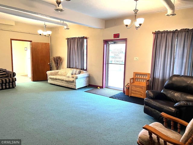 carpeted living room with a notable chandelier and beam ceiling