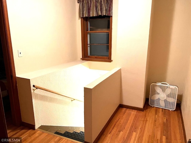 103 Pearl St, Adrian, MN 56110 - corridor featuring baseboards and light wood finished floors