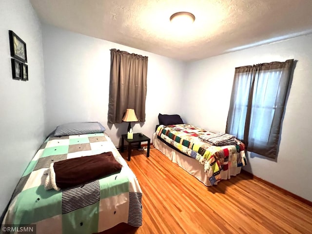 bedroom with hardwood / wood-style flooring