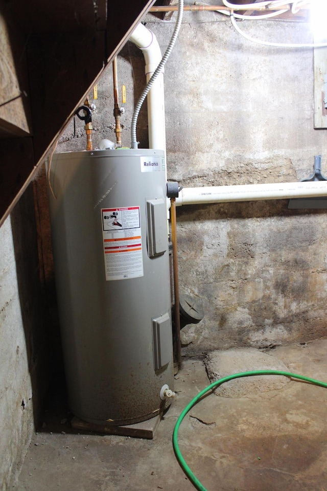 utility room featuring electric water heater