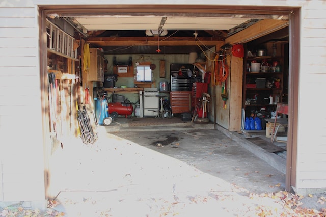 garage with a garage door opener and wooden walls