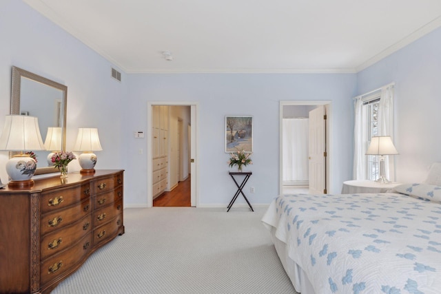 carpeted bedroom with crown molding