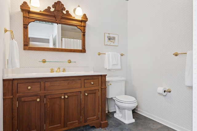 bathroom with tile patterned floors, toilet, and vanity