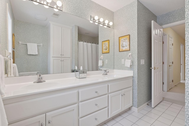 bathroom with vanity and tile patterned floors