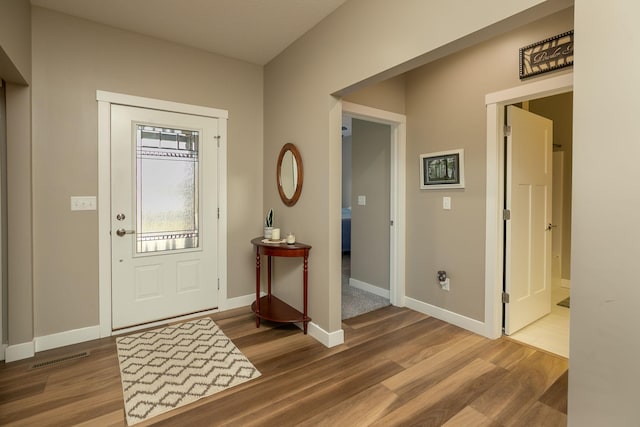 entrance foyer featuring hardwood / wood-style flooring