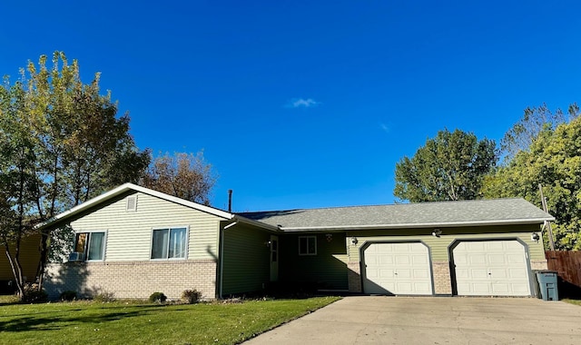 single story home with a front yard and a garage