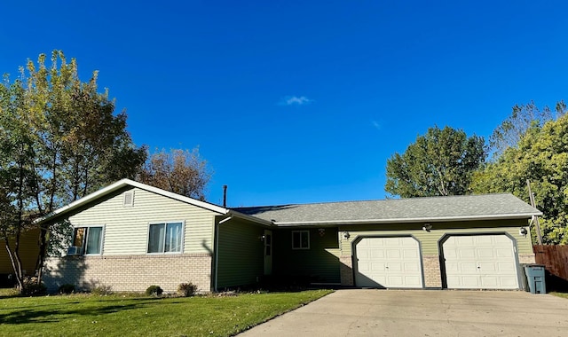 313 10th Ave NE, Roseau, MN 56751 - ranch-style home with an attached garage, brick siding, driveway, and a front yard