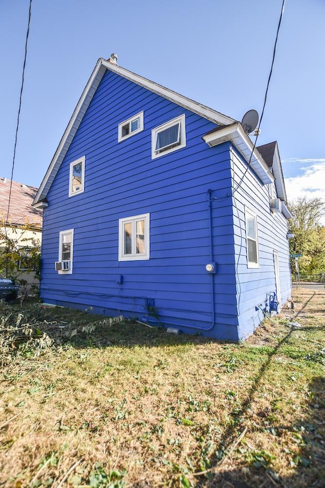 view of side of property featuring cooling unit