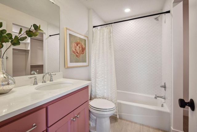 full bathroom with vanity, toilet, and shower / bath combo