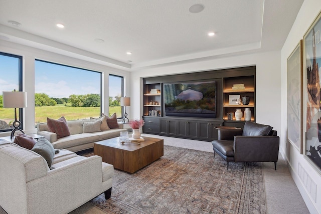 living room with a textured ceiling and carpet flooring