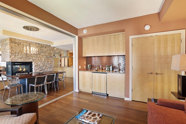 living room with dark wood-type flooring and a fireplace