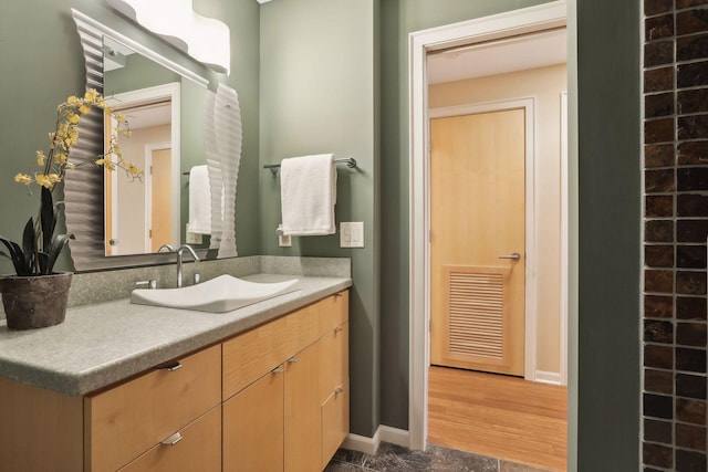 bathroom with vanity and hardwood / wood-style flooring